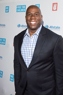 CHICAGO, IL - APRIL 30:  NBA legend, two-time Hall-of-Famer, entrepreneur and philanthropist, Earvin "Magic" Johnson walks the We Day Red Carpet at We Day Illinois 2015 at Allstate Arena on April 30, 2015 in Chicago, Illinois. (Photo by Jeff Schear/Getty Images for We Day).