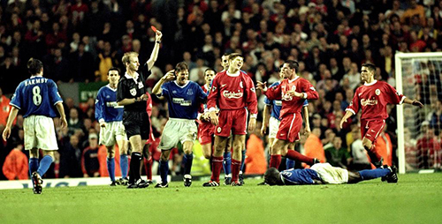 27 Sep 1999:  Steven Gerrard of Liverpool is shown the red card after his foul on Everton's Kevin Campbell (floor) during the FA Premier League match between Liverpool and Everton played at Anfiled, Liverpool, England. The Merseyside derby finished in a1-0 win for visitors Everton.  Mandatory Credit: Michael Steele /Allsport