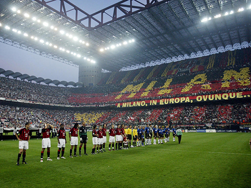 MILAN - MAY 7:  AC Milan and Inter Milan players line-up in front of an amazing atmosphere before the UEFA Champions League Semi-Final First Leg match between AC Milan and Internazionale Milano held on May 7, 2003 at the Guiseppe Meazza San Siro, in Milan, Italy. The match ended in a 0-0 draw. (Photo by Michael Steele/Getty Images)